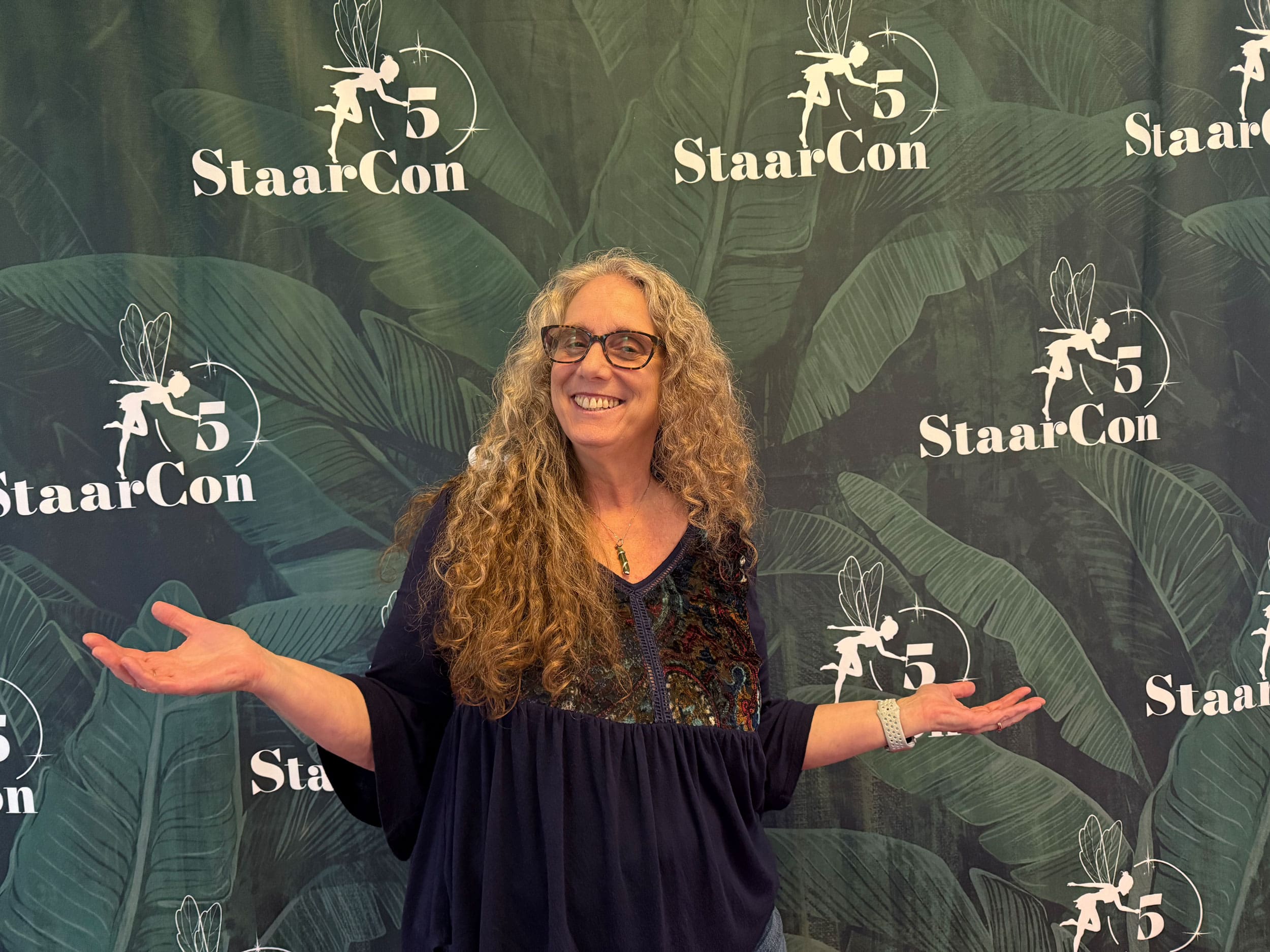 Christiana Gaudet with the StaarCon 5 banner.