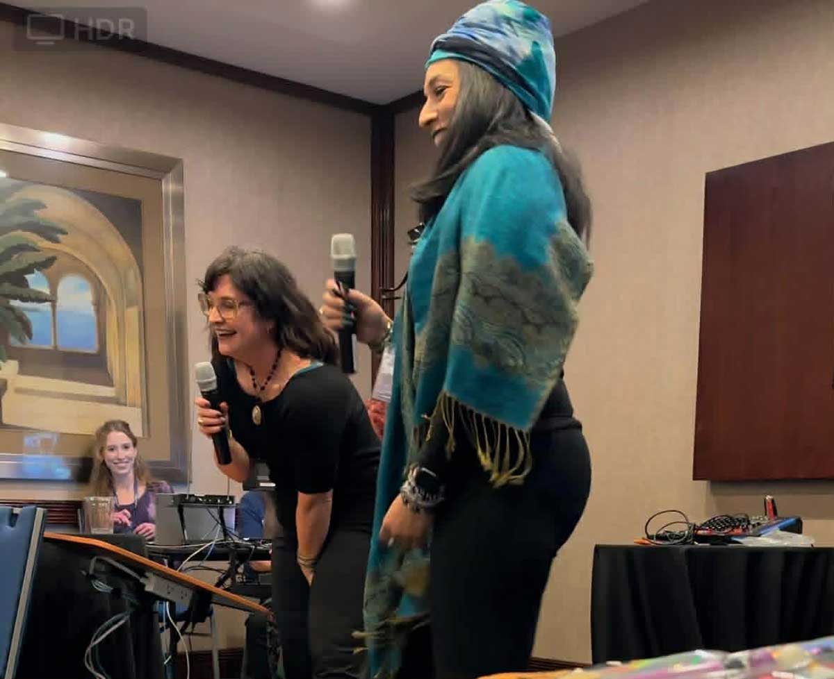 Stacey Williams-Ng and Mam'selle Kamille tell a ghost story at StaarCon 2024.