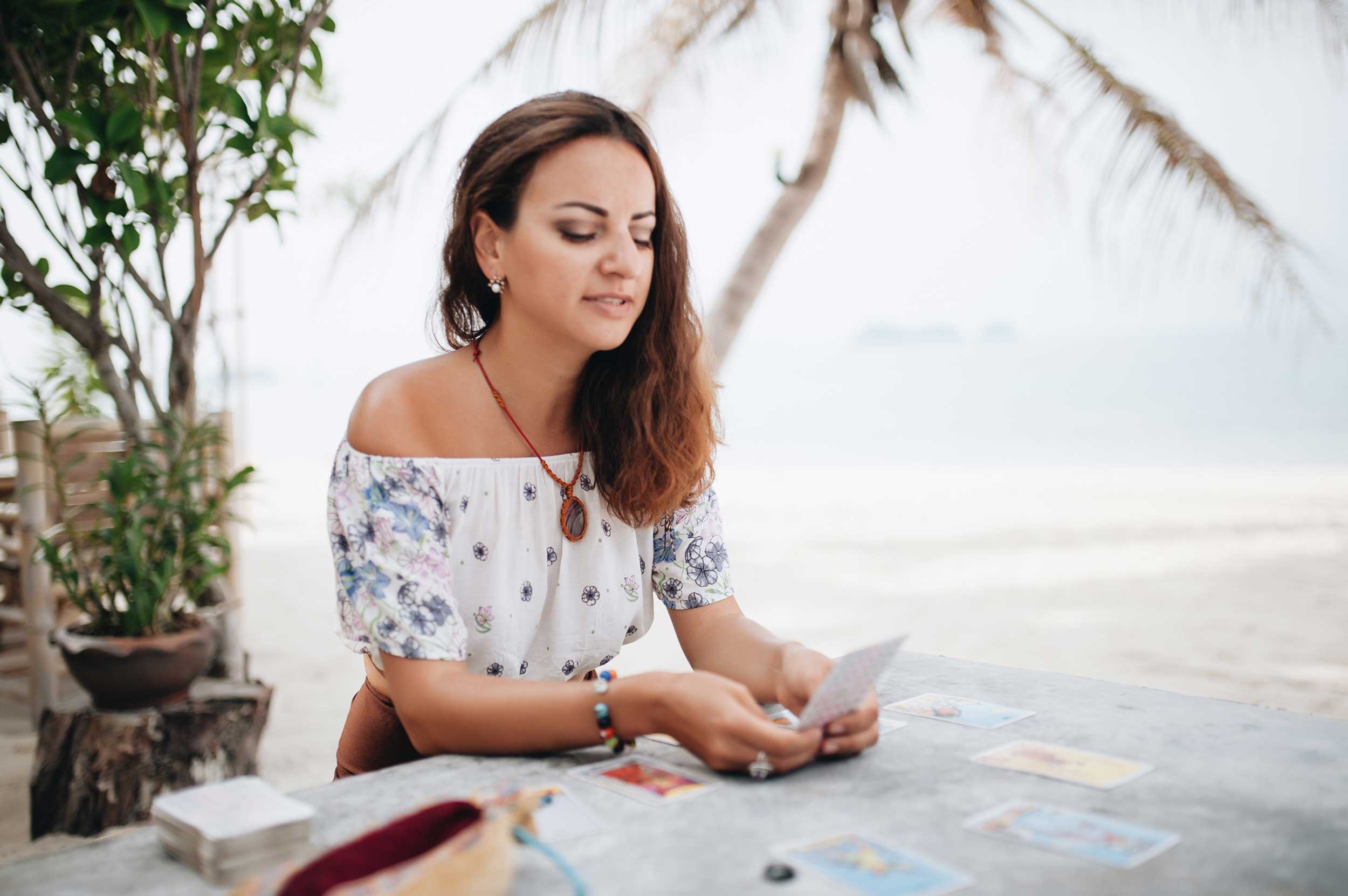 Woman Reading Tarot Cards at a Table