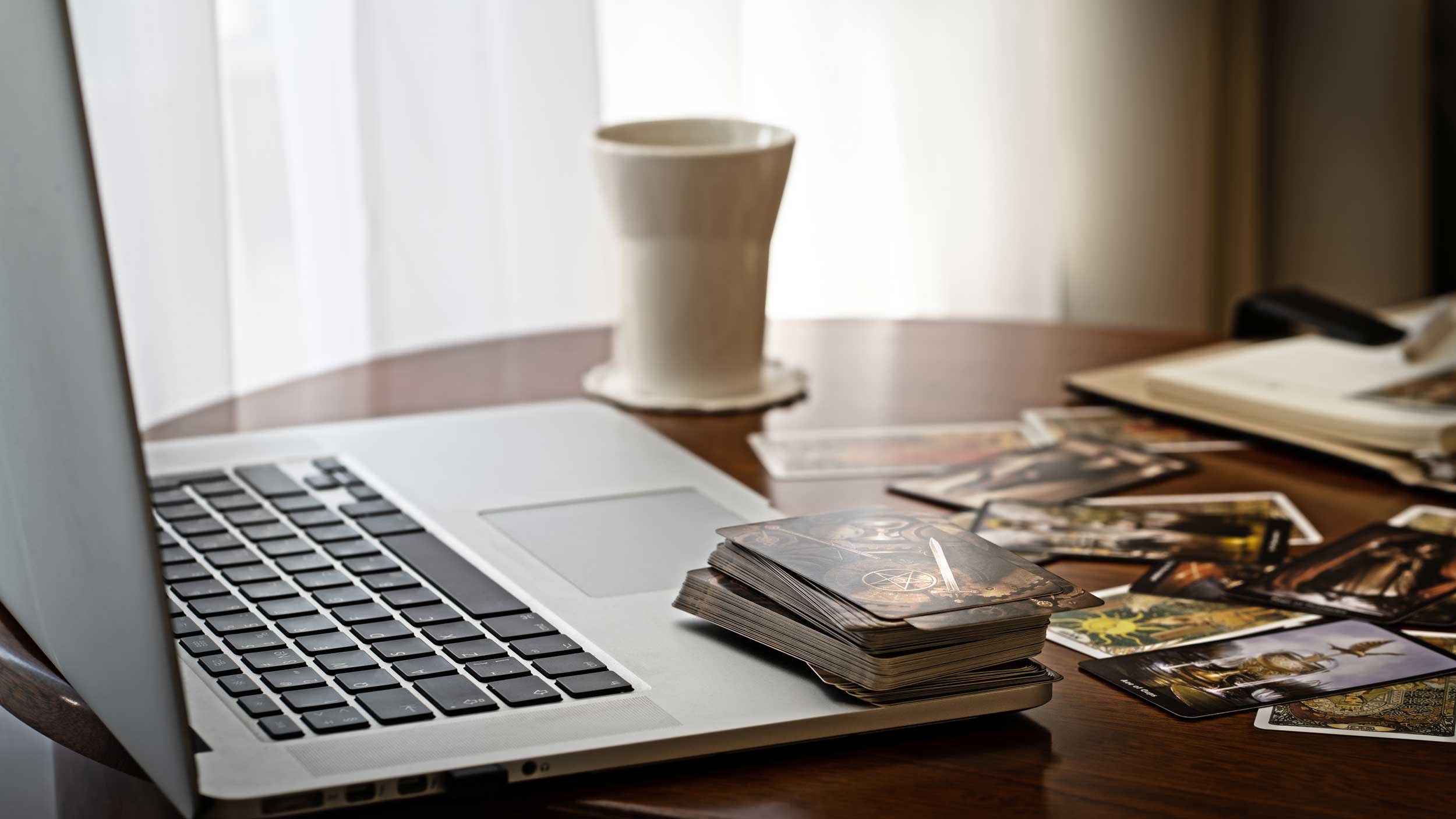 Laptop computer and tarot cards