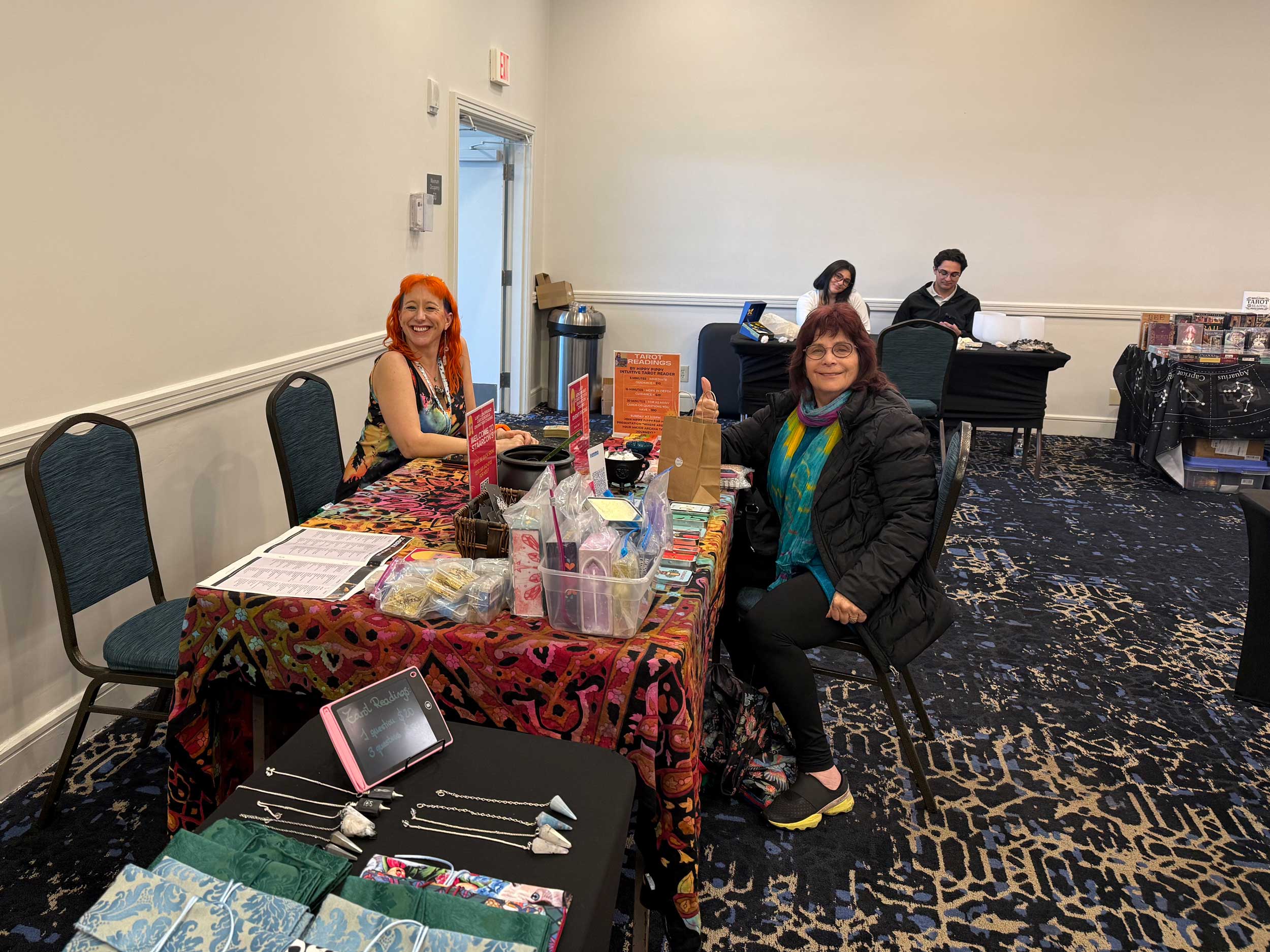 StaarCon 5 presenter Hippy Pippy giving readings in the exhibition hall.